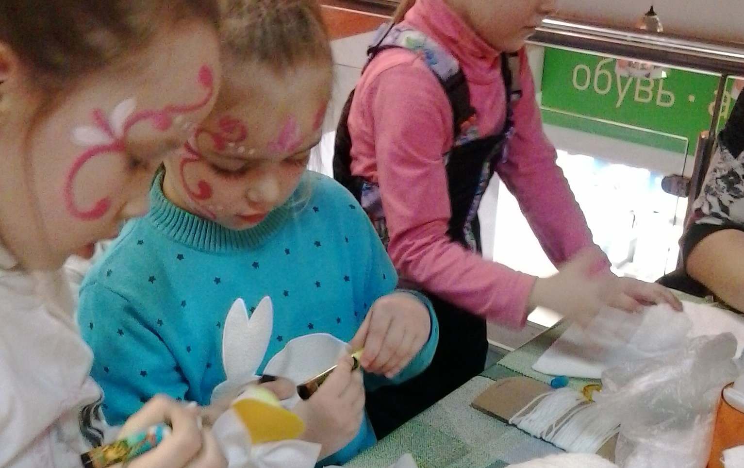 three happy kids making stuff